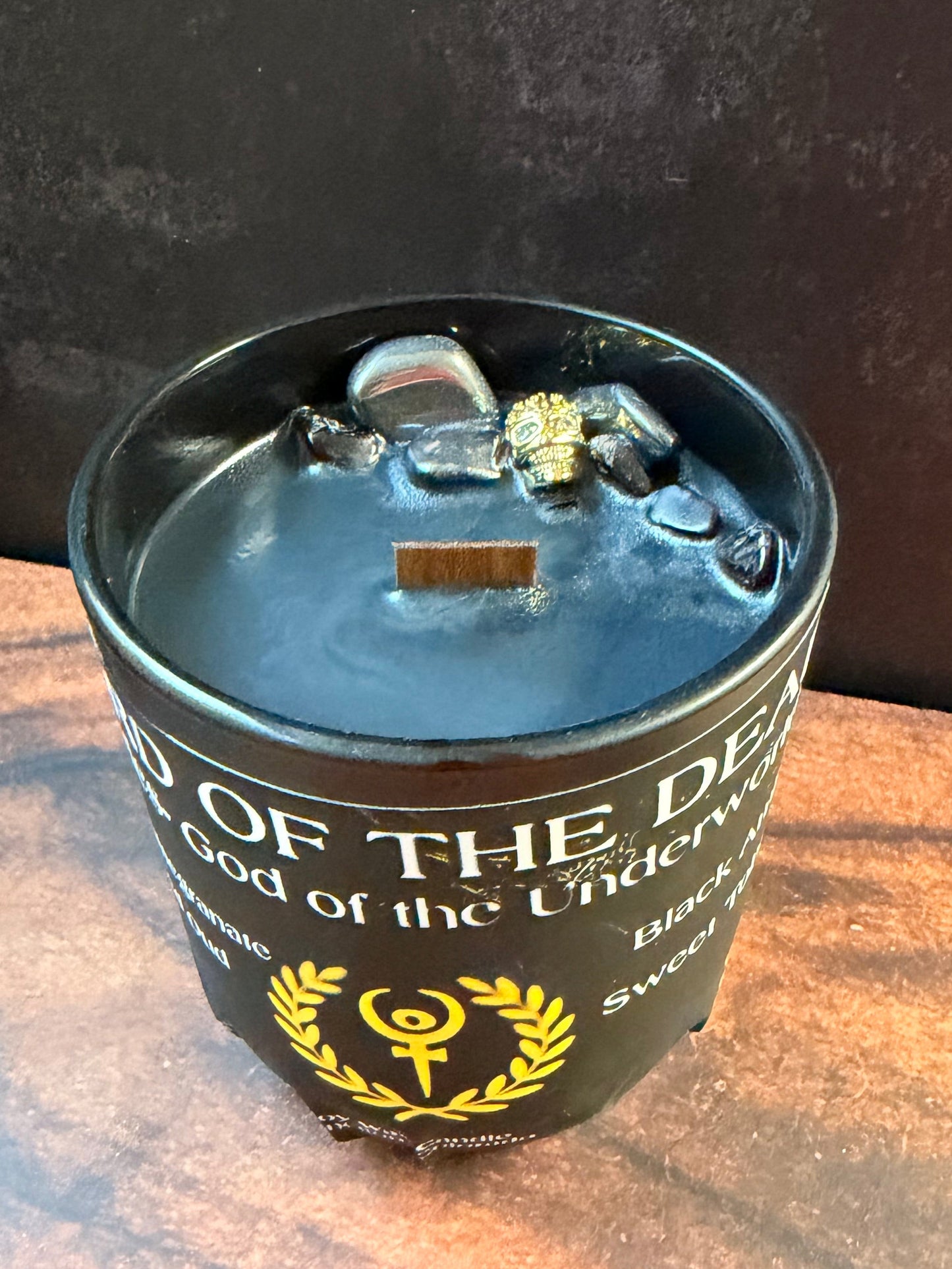 Candle in a black ceramic container 